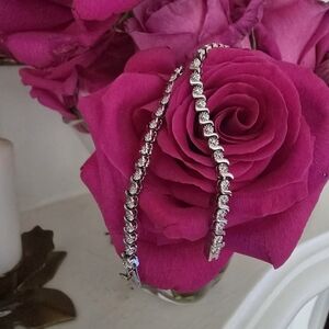 Elegant Silver Bracelet Rhodium plated and weighs 9.72 grams.